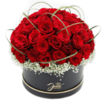 Red roses in a black basket from JuneFlowers.com
