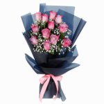 Designer Bouquet of 12 Red Roses in a black wrapping in JuneFlowers.com