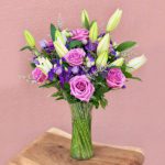 Lavish Pink Roes with Lilly in vase JuneFlowers.com