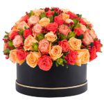 Warm Orange, Peach, Light Pink Roses with Black Round Box from JuneFlowers.com
