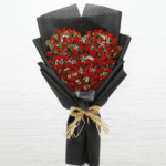 Romantic Heart shape Red roses in a black wrapping sheet from JuneFlowers.com
