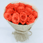Beautiful Orange roses in a white wrapping from JuneFlowers.com