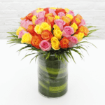 Colourful Roses in a cylindrical vase from JuneFlowers.com