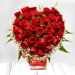 Beautiful Red roses in a heart shape in a vase from JuneFlowers.com